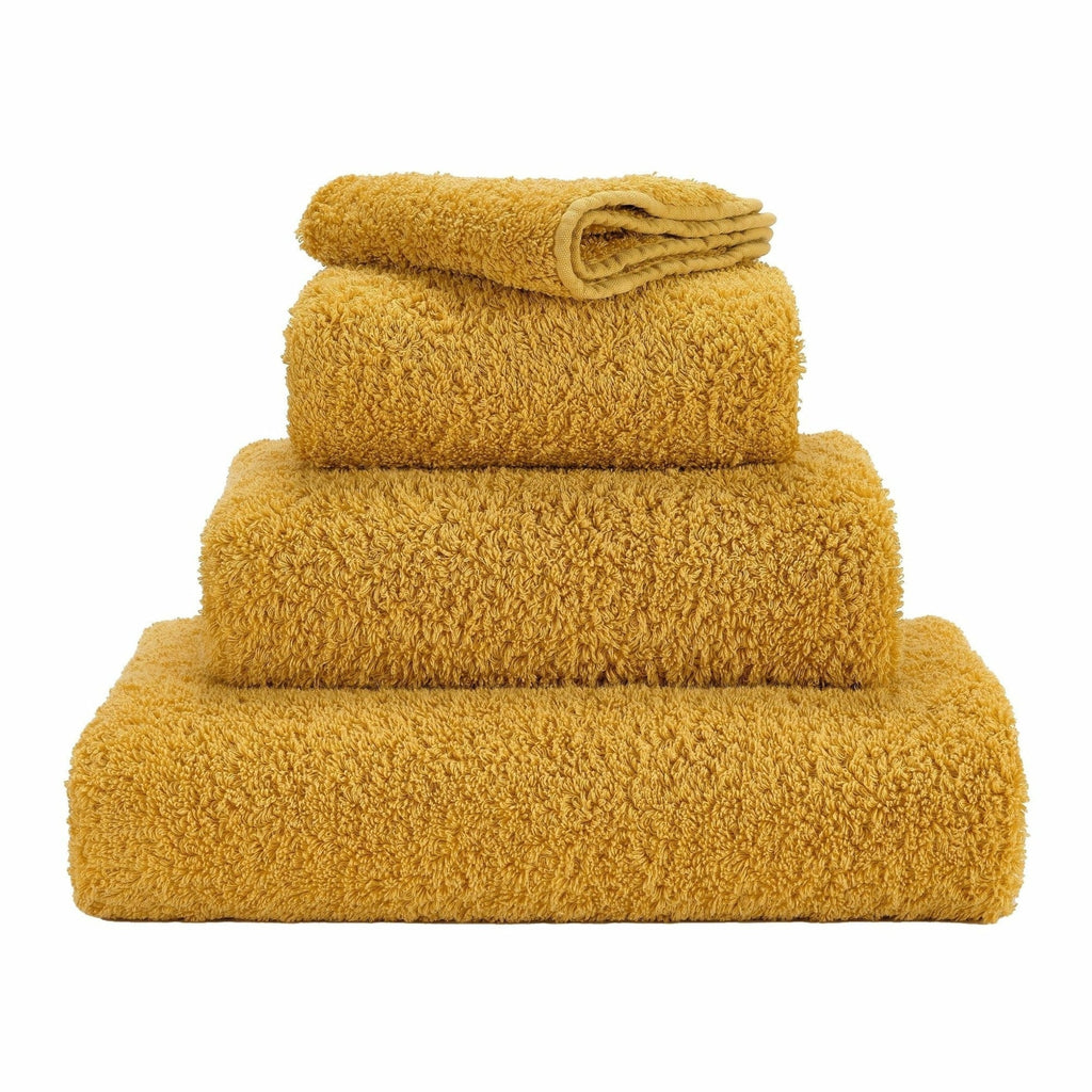 Abyss Super Pile Towels in 850 Safran. Available in Canada @ TMASC.