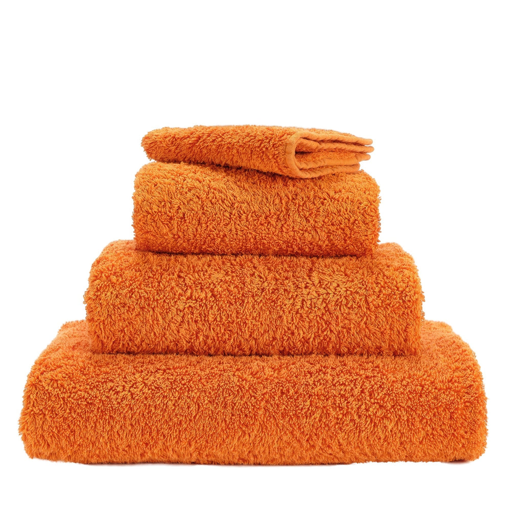 Abyss Super Pile Towels in 614 Tangerine. Available in Canada @ TMASC.