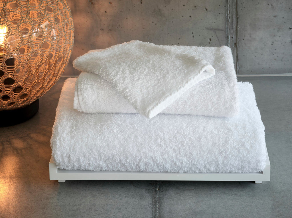 Abyss Super Pile Towels in 100 White. Top: wash-mitt.