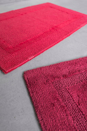 Abyss & Habidecor Reversible Rug (top): 579 Viva Magenta and (bottom): 578 Canyon