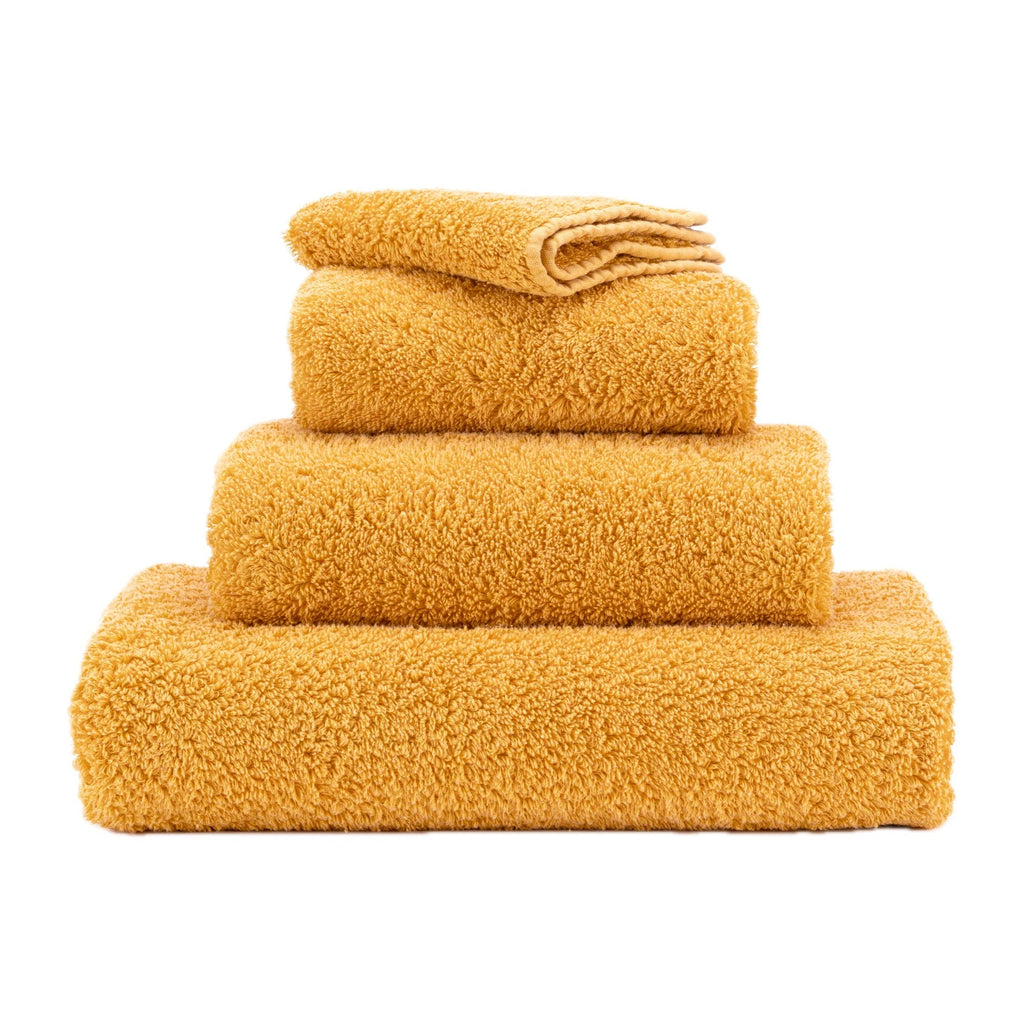 Abyss Super Pile Towels in 870 Curcuma. Available in Canada @ TMASC.