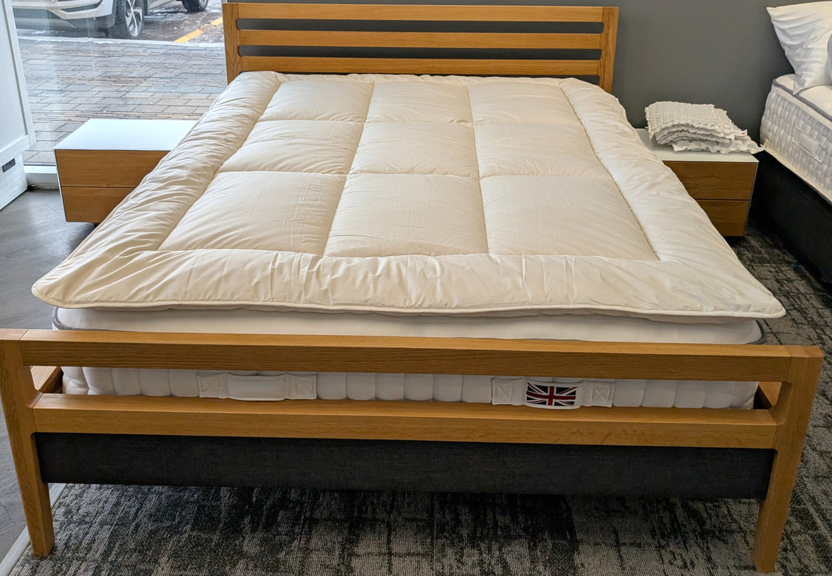 Alpaca topper in our Sherwood Park store shown on a Harrison Spinks British mattress and TEAM 7 bed frame from Austria