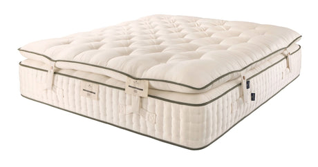 The optional mattress enhancer is a two-sided flippable pillowtop with 6,000 micro pocket springs in queen size, and filled with British wool, hemp & flax, along with Herdwick wool.