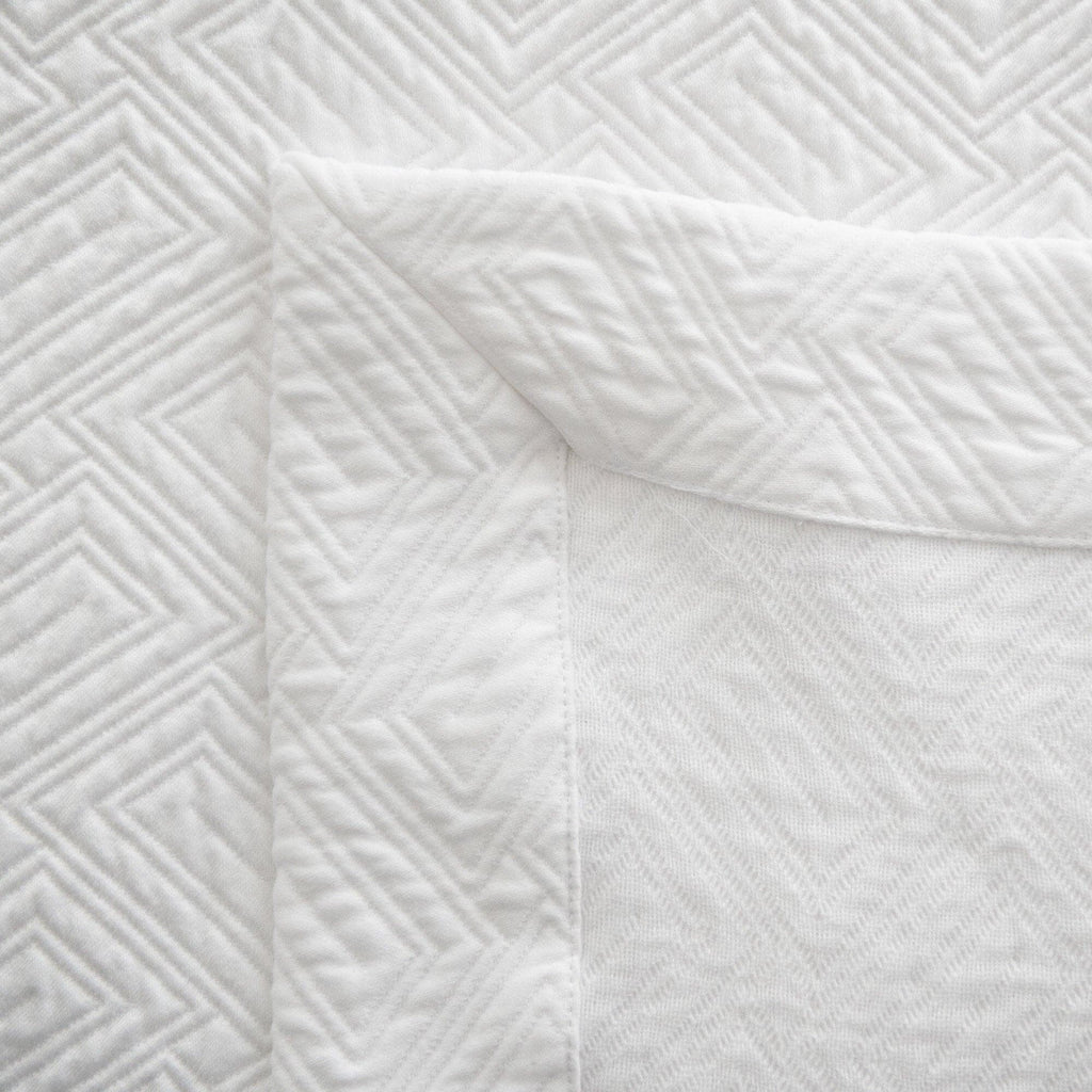 Scala Coverlet in White - corner detail + view of reverse side of coverlet.